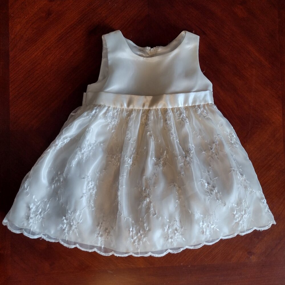 This gorgeous Cream colored  dress size 12 month made by Cinderella.